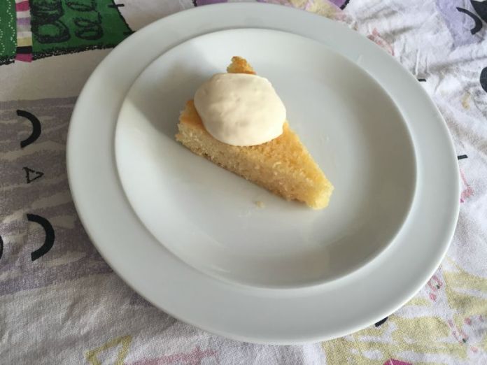 Slice of St Clementine cake with yoghurt